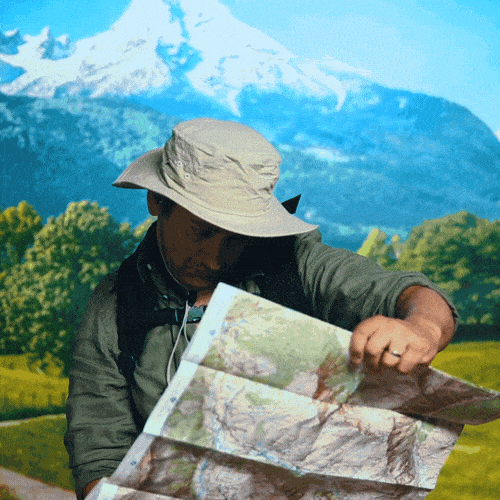 Wilderness explorer checking his map